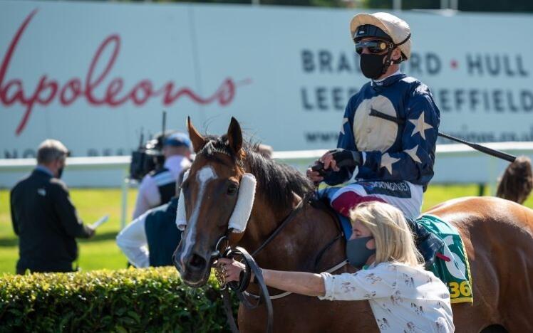 Masked jockey at Doncaster Racecourse 