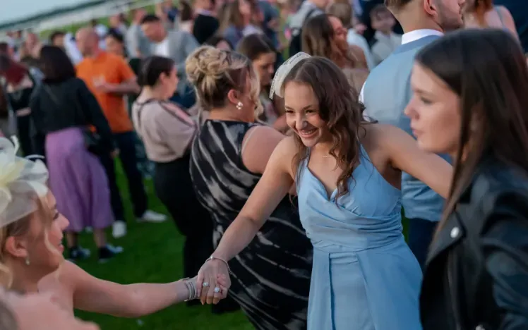 A group of friends enjoying a music event at Doncaster Racecourse
