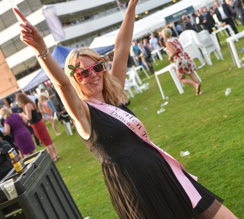 A women on a hen do enjoying her day at Doncaster Races
