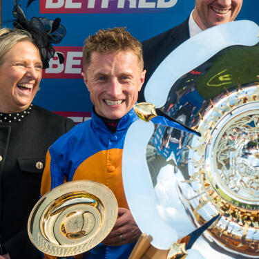 Tom Marquand celebrating after  winning the St Leger Stakes