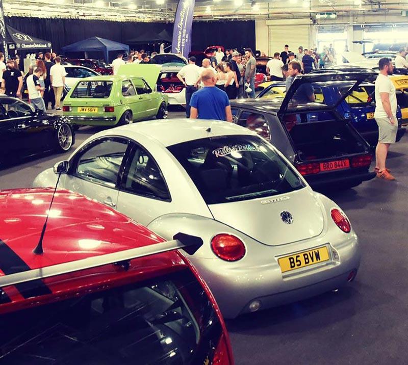 A collection of cars in a conference room at Doncaster Racecourse.