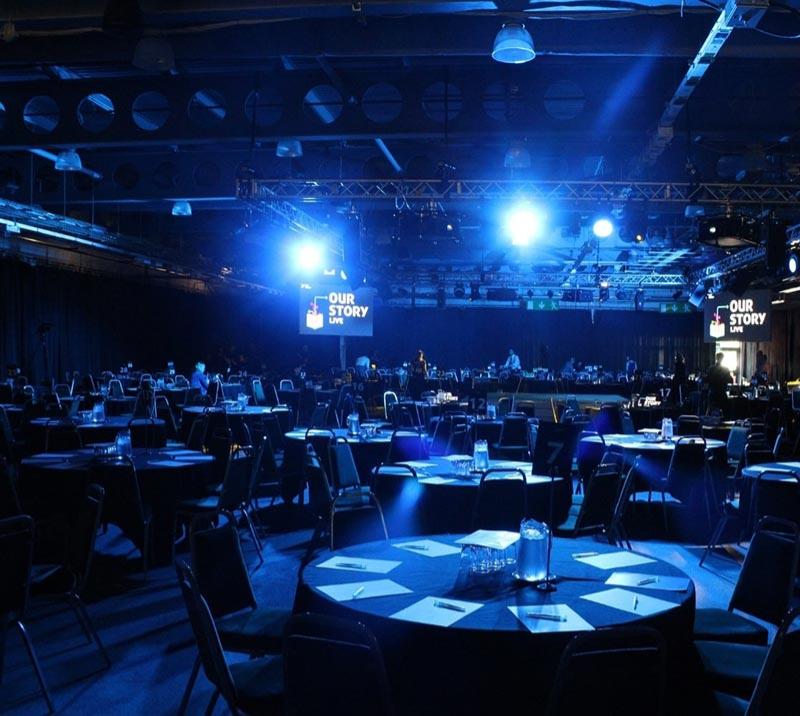 A large low-light conference room at Doncaster Racecourse.