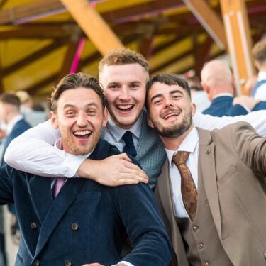 Three men partying on Betfred St Leger Day