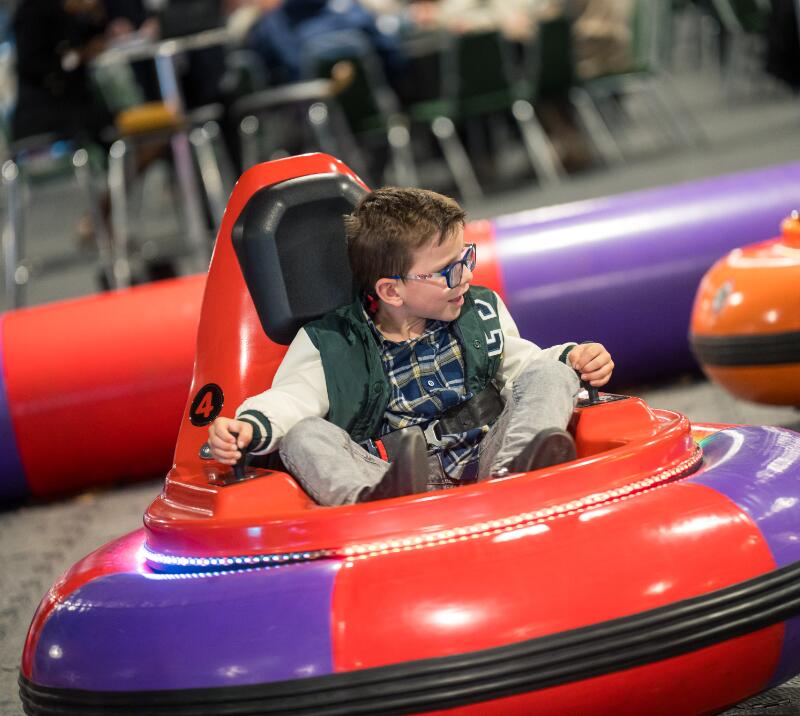 A child playing in a hovercar at Doncaster Racecourse on Family Funday at the St Leger Festival.