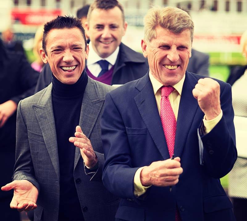 Two men fist pump and cheer